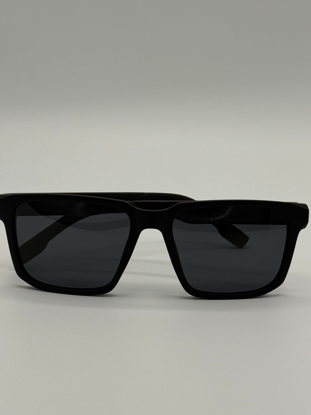 Black sunglasses with OBL x BOCI